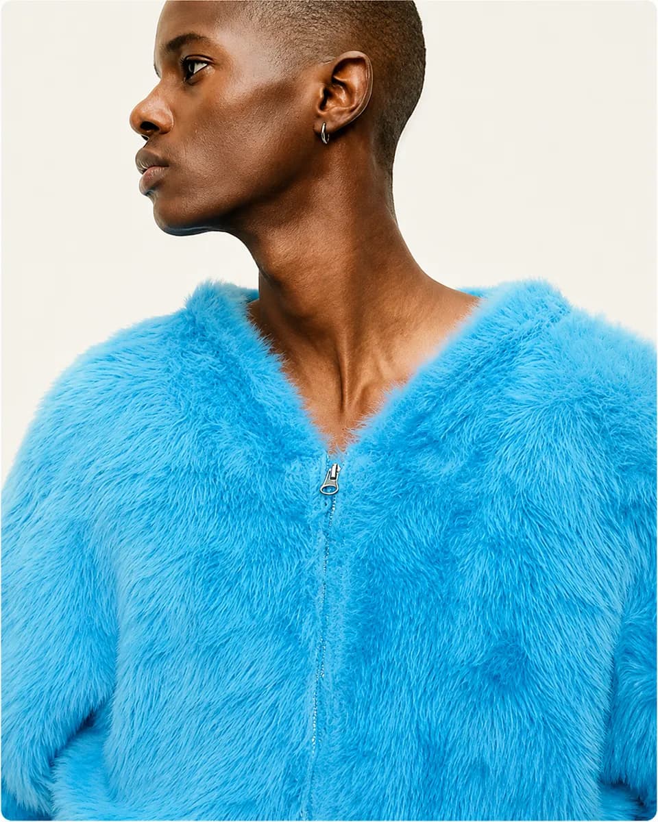 Model in a bright blue textured zip jacket